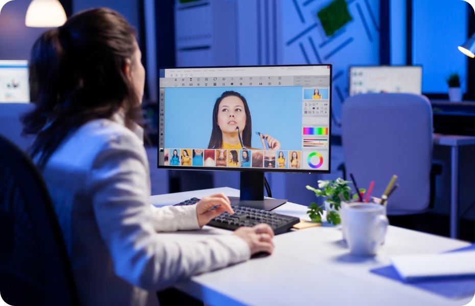 creative creator doing portrait retouch using color grade late night professional editing office